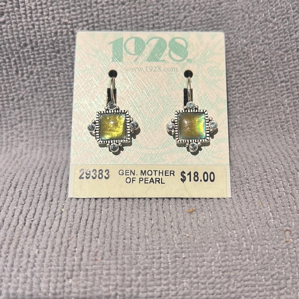 Earrings with Genuine Mother of Pearl. Brand: 1928. Never Worn. Condition New.